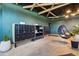 Community mail room featuring designer hanging lounge chairs and decorative plants at 1601 Park Ave # 202, Denver, CO 80218