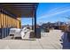 Spacious rooftop deck with modern seating and skyline views at 1601 Park Ave # 202, Denver, CO 80218