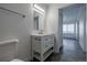 Contemporary bathroom featuring a stylish vanity, modern mirror, and fixtures, designed for comfort and convenience at 69101 E 72Nd Ave, Byers, CO 80103