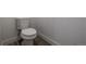 Modern toilet with sleek design and wood-look flooring, providing a clean and functional bathroom space at 69101 E 72Nd Ave, Byers, CO 80103