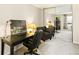 Bedroom with a large mirrored closet reflecting a workspace with desk, chairs, and city views at 1020 15Th St # 16A, Denver, CO 80202