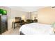 Bedroom with a large mirrored closet reflecting a workspace with desk and chairs at 1020 15Th St # 16A, Denver, CO 80202