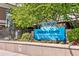 Community sign for Brooks Tower, featuring manicured landscaping and a decorative statue at 1020 15Th St # 16A, Denver, CO 80202