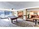 Game room with a billiard table, seating areas, and a decorative carpet design at 1020 15Th St # 16A, Denver, CO 80202