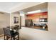 Modern kitchen featuring granite countertops, stainless steel appliances, breakfast bar, and updated cabinetry at 1020 15Th St # 16A, Denver, CO 80202