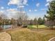 Landscaped backyard with putting green and basketball court at 18950 E Geddes Ave, Centennial, CO 80016