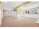 Finished basement offering a large open area with neutral walls and carpet at 18950 E Geddes Ave, Centennial, CO 80016