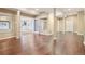 Finished basement with hardwood floors and french doors leading to another room at 18950 E Geddes Ave, Centennial, CO 80016