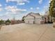 Three-car garage with large driveway at 18950 E Geddes Ave, Centennial, CO 80016