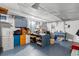 Bright basement featuring colorful storage cabinets and a utility sink at 357 Birch St, Denver, CO 80220