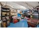 Unfinished basement space with shelving and storage, offering potential for customization at 357 Birch St, Denver, CO 80220