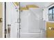 Bathroom with a glass-enclosed bathtub and a shower with white subway tile at 357 Birch St, Denver, CO 80220