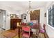 Elegant dining room featuring a chandelier, wood table, and charming decor at 357 Birch St, Denver, CO 80220