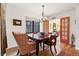 Open dining area with hardwood floors, bright light, and traditional style dining furniture at 357 Birch St, Denver, CO 80220