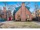 Charming brick home featuring a stone walkway, a cozy front yard, and a welcoming entrance at 357 Birch St, Denver, CO 80220