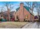 Charming brick home featuring a driveway, a cozy front yard, and a welcoming entrance at 357 Birch St, Denver, CO 80220