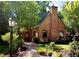 Charming brick home with a manicured lawn and lush landscaping at 357 Birch St, Denver, CO 80220