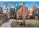 Charming brick home featuring a stone walkway, a cozy front yard, and a welcoming entrance at 357 Birch St, Denver, CO 80220