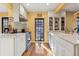 Well-lit kitchen showcasing stainless steel appliances, white subway tile backsplash, and ample counter space at 357 Birch St, Denver, CO 80220