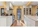 Spacious kitchen with white cabinets, hardwood floors, and stainless steel appliances at 357 Birch St, Denver, CO 80220