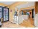 Open kitchen with access to backyard, bright light, white cabinets and island countertop seating at 357 Birch St, Denver, CO 80220