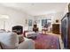 Comfortable living room featuring a fireplace, hardwood floors and stylish decor at 357 Birch St, Denver, CO 80220