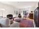 Inviting living room featuring a fireplace, hardwood floors, and abundant natural light at 357 Birch St, Denver, CO 80220