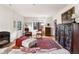 Inviting living room featuring a fireplace, hardwood floors, and abundant natural light at 357 Birch St, Denver, CO 80220
