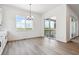 Charming dining area with a view and sliding door access to the outdoors at 8658 Pennycress Dr, Littleton, CO 80125