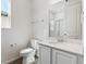 Bright bathroom with white vanity, modern fixtures, and a glass-enclosed shower, providing a clean and functional design at 9151 Telluride Ct, Commerce City, CO 80022