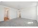 Spacious bedroom with neutral carpet and an attached bathroom at 9151 Telluride Ct, Commerce City, CO 80022