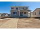Two-story home featuring gray siding, black shutters, and a covered porch for curb appeal at 9151 Telluride Ct, Commerce City, CO 80022