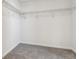 Walk-in closet with wire shelving and neutral carpet at 9151 Telluride Ct, Commerce City, CO 80022