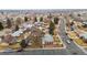 Aerial perspective of the property on a tree-lined street in a quiet residential neighborhood with mature landscaping at 3261 Kassler Pl, Westminster, CO 80031