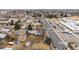 Home featuring a well-manicured lawn and mature trees with a view of the quiet neighborhood at 3261 Kassler Pl, Westminster, CO 80031
