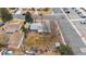 Aerial view of a home's backyard featuring a patio with seating, and mature landscaping at 3261 Kassler Pl, Westminster, CO 80031