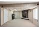 Finished basement featuring a fireplace, neutral carpet, and access to additional rooms at 3261 Kassler Pl, Westminster, CO 80031