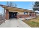Charming single-story home with brick accents, covered entry, and attached garage with plentiful storage space at 3261 Kassler Pl, Westminster, CO 80031