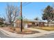 Corner lot house with brick and siding, featuring a driveway and landscaping at 3261 Kassler Pl, Westminster, CO 80031