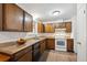 Efficient kitchen with wood cabinets, laminate countertops, and bright lighting at 3261 Kassler Pl, Westminster, CO 80031