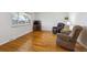 Spacious living room with hardwood flooring and large window at 3261 Kassler Pl, Westminster, CO 80031