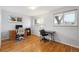Bright room featuring two desks, a hardwood floor, and natural light from windows at 3261 Kassler Pl, Westminster, CO 80031