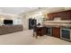 Basement features a wet bar, seating, open area and sofa, for entertaining and relaxing at 26861 E Clifton Dr, Aurora, CO 80016