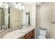 A clean and well-maintained bathroom with tile counters, a sink, and toilet at 26861 E Clifton Dr, Aurora, CO 80016