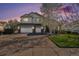 Charming two-story home featuring a three car garage, stone accents, and manicured lawn at 26861 E Clifton Dr, Aurora, CO 80016
