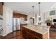 Spacious kitchen featuring granite countertops, stainless steel appliances, and beautiful dark wood cabinetry at 26861 E Clifton Dr, Aurora, CO 80016