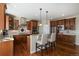 Well-appointed kitchen with granite countertops, stainless steel appliances, breakfast bar, and hardwood floors at 26861 E Clifton Dr, Aurora, CO 80016