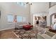 Open-concept living room with hardwood floors and a view into the updated kitchen area at 26861 E Clifton Dr, Aurora, CO 80016