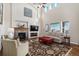 Inviting living room with a cozy fireplace, tall ceilings, and large windows offering scenic views at 26861 E Clifton Dr, Aurora, CO 80016