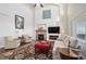 Spacious living room featuring a fireplace, comfortable seating, and soaring ceilings for an airy feel at 26861 E Clifton Dr, Aurora, CO 80016